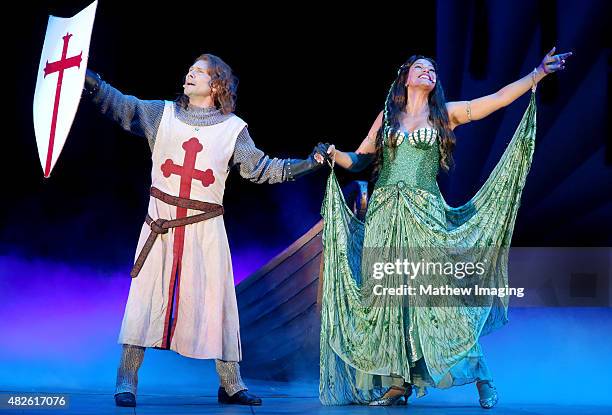 Actors Christian Slater and Merle Dandridge perform onstage during Monty Python Spamalot at the Hollywood Bowl on July 31, 2015 in Hollywood,...