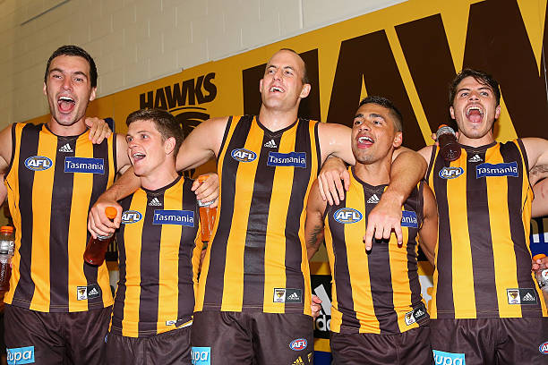 Jonathon Ceglar, Taylor Duryea, David Hale, Bradley Hill and Isaac Smith of the Hawks sing the song in the rooms after winning the round three AFL...