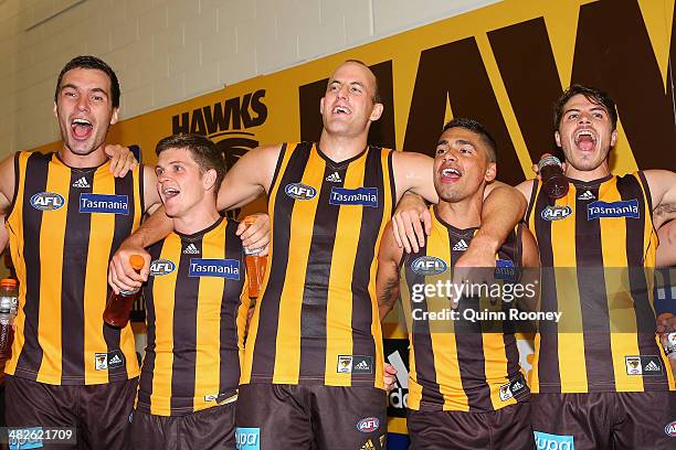 Jonathon Ceglar, Taylor Duryea, David Hale, Bradley Hill and Isaac Smith of the Hawks sing the song in the rooms after winning the round three AFL...