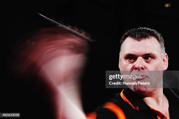 Craig Caldwell competes in the Super League Darts semi final match between Craig Caldwell and Peter Hunt at Sky City on August 1, 2015 in Auckland,...