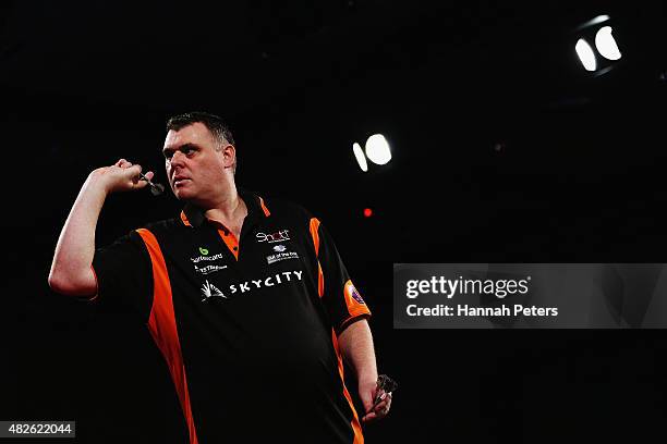 Craig Caldwell competes in the Super League Darts semi final match between Craig Caldwell and Peter Hunt at Sky City on August 1, 2015 in Auckland,...