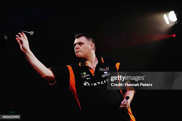 Craig Caldwell competes in the Super League Darts semi final match between Craig Caldwell and Peter Hunt at Sky City on August 1, 2015 in Auckland,...