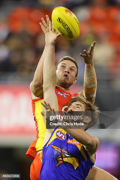 Sam Day of the Suns and Brad Sheppard of the Eagles compete for the mark during the round 18 AFL match between the Gold Coast Suns and the West Coast...