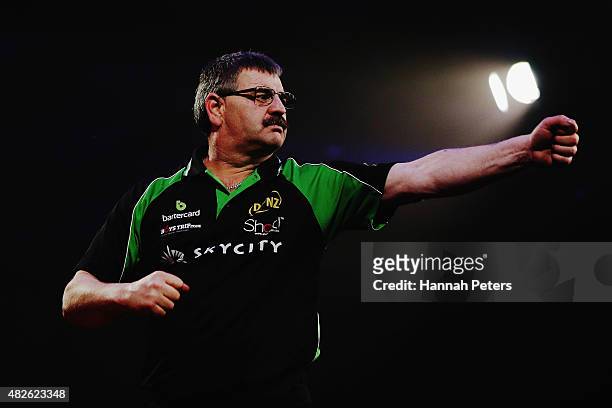 Warren Parry celebrates after winning a game during Super League Darts Final between Warren Parry and Craig Caldwell at Sky City on August 1, 2015 in...