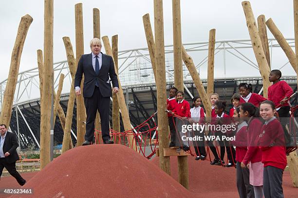 Mayor of London, Boris Johnson explores a new playground with a group of children from Gainsborough Primary school in Newham during an official visit...