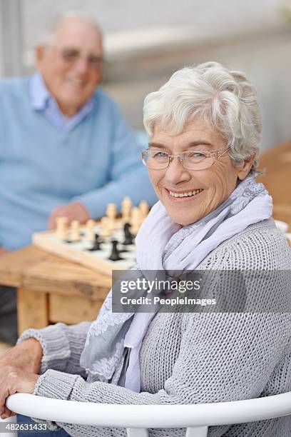 he doesn't know i'm a chess master! - senior playing chess stock pictures, royalty-free photos & images