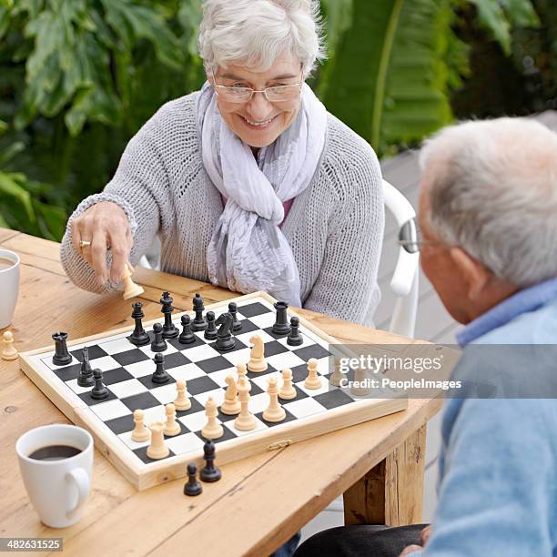 this next moves is going to win me the game! - senior playing chess stock pictures, royalty-free photos & images