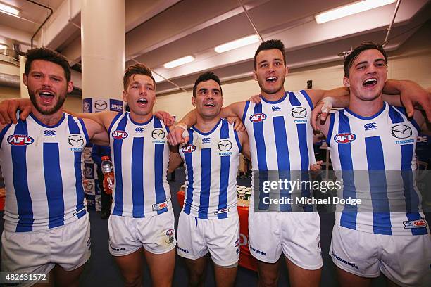 Sam Gibson Shaun Higgins, Lindsay Thomas, Robbie Tarrant and Taylor Garner of the Kangaroos celebrates the win during the round 18 AFL match between...