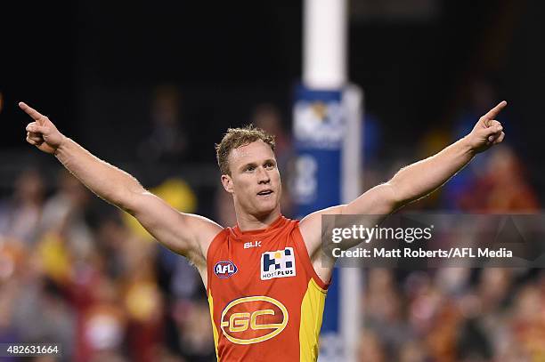 Brandon Matera of the Suns celebrates kicking a goal during the round 18 AFL match between the Gold Coast Suns and the West Coast Eagles at Metricon...