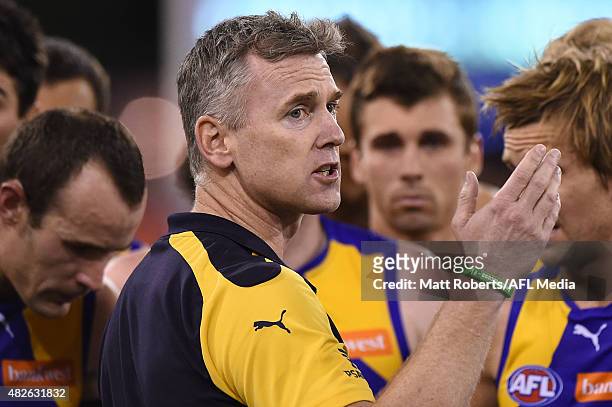 Coach Adam Simpson of the Eagles speaks to his players during the round 18 AFL match between the Gold Coast Suns and the West Coast Eagles at...