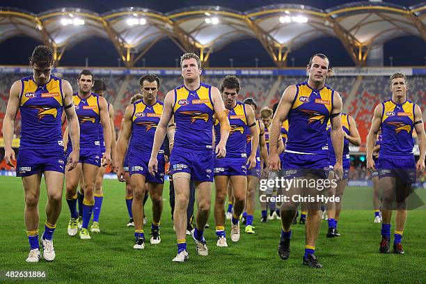 Eagles leave the field after a draw during the round 18 AFL match between the Gold Coast Suns and the West Coast Eagles at Metricon Stadium on August...