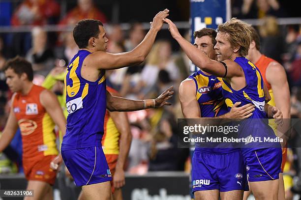 Mark LeCras of the Eagles celebrates kicking a goal with team mates during the round 18 AFL match between the Gold Coast Suns and the West Coast...