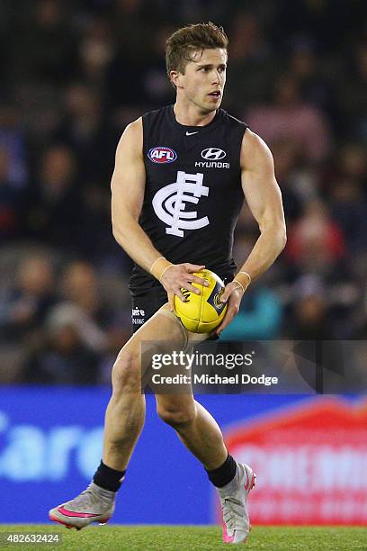 Marc Murphy of the Blues looks upfield during the round 18 AFL match between the Carlton Blues and the North Melbourne Kangaroos at Etihad Stadium on...