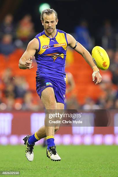 Will Scholfield of the Eagles kicks during the round 18 AFL match between the Gold Coast Suns and the West Coast Eagles at Metricon Stadium on August...