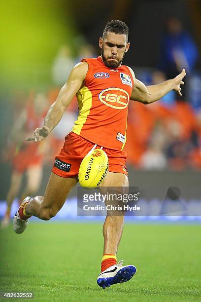 Harley Bennell of the Suns kicks during the round 18 AFL match between the Gold Coast Suns and the West Coast Eagles at Metricon Stadium on August 1,...