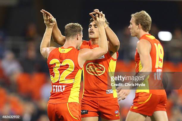 Andrew Boston of the Suns celebrates a goal during the round 18 AFL match between the Gold Coast Suns and the West Coast Eagles at Metricon Stadium...