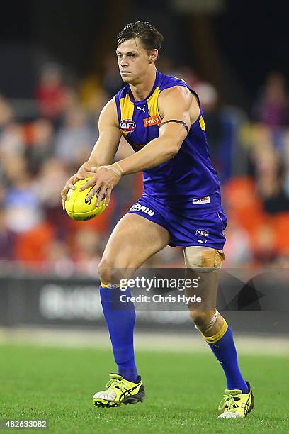 Callum Sinclair of the Eagles kicks during the round 18 AFL match between the Gold Coast Suns and the West Coast Eagles at Metricon Stadium on August...