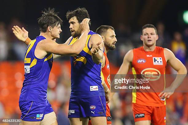 Callum Sinclair and Josh Kennedy of the Eagles celebrate a goal during the round 18 AFL match between the Gold Coast Suns and the West Coast Eagles...