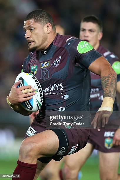 Willie Mason of the Sea Eagles runs the ball during the round 21 NRL match between the Manly Sea Eagles and the Brisbane Broncos at Central Coast...