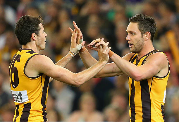 Isaac Smith and Jack Gunston of the Hawks celebrate a goal during the round three AFL match between the Hawthorn Hawks and the Fremantle Dockers at...