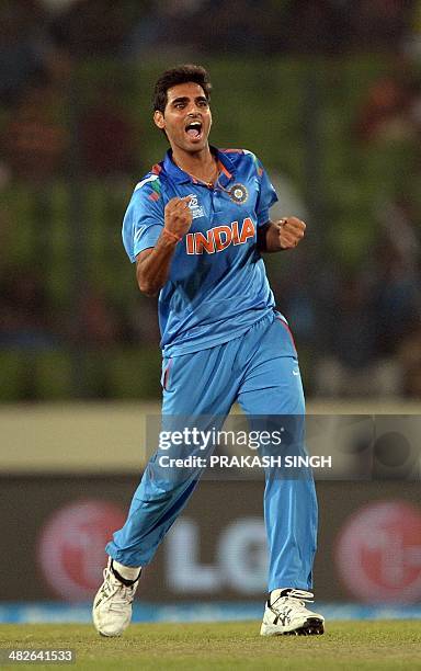 Indian cricketer Bhuvneshwar Kumar celebrates the wicket of South Africa batsman Quinton de Kock during the ICC World Twenty20 cricket tournament...