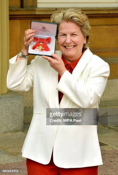 Sandi Toksvig holds her OBE , after it was presented to her by Prince Charles, Prince of Wales during an Investiture Ceremony at Buckingham Palace on...