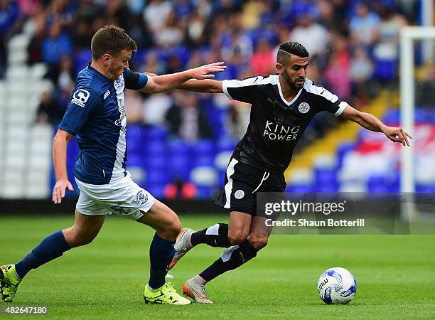 Riyad Mahrez of Leicester City is challenged by Stephen Gleeson of Birmingham City during the Pre-Season Friendly match between Birmingham City and...