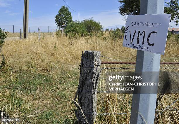 Picture taken on August 1, 2015 in Bure, eastern France, shows a sign indicating the direction of the "VMC camp" which will take place from August 1...