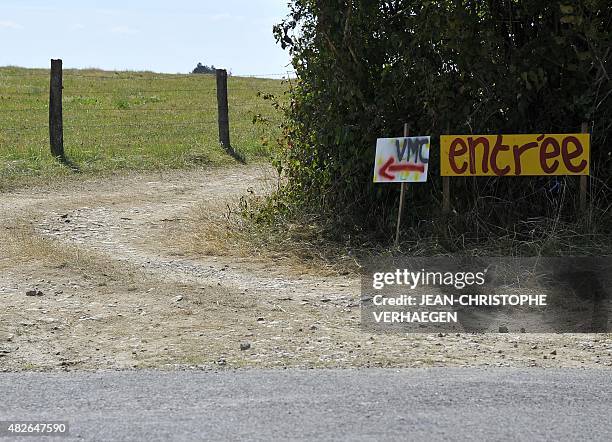 Picture taken on August 1, 2015 between Lumeville and Mandres-en-Barrois, eastern France, shows a sign indicating the entrance of the "VMC camp"...