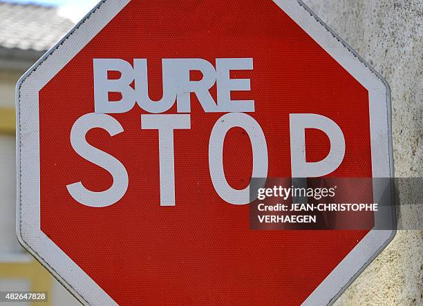 Road sign is tagged "Bure Stop", on August 1 in Bure, eastern France. The "VMC camp" will take place from August 1 to 10 to protest against the Cigeo...