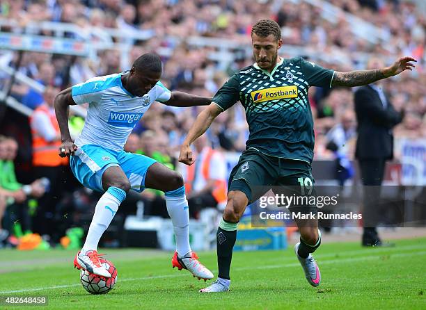 Chancel Mbemba of Newcastle takes on Fabian Johnson of Borussia Moenchengladbach during the Pre Season Friendly between Newcastle United and Borussia...