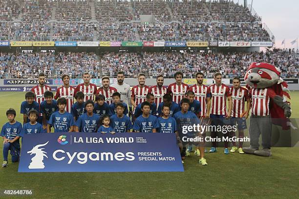Players of Atletico Madrid pose for a team photo ahead of the friendly match between Atletico Madrid and Sagan Tosu F.C. At Tosu Stadium on August 1,...