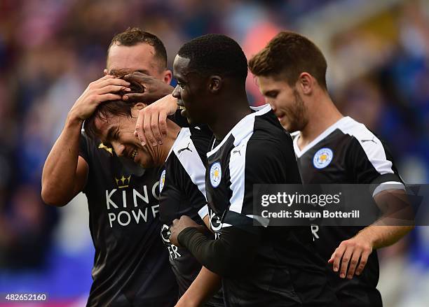 Shinji Okazaki of Leicester City is congratulated by team-mates after scoring during the Pre-Season Friendly match between Birmingham City and...