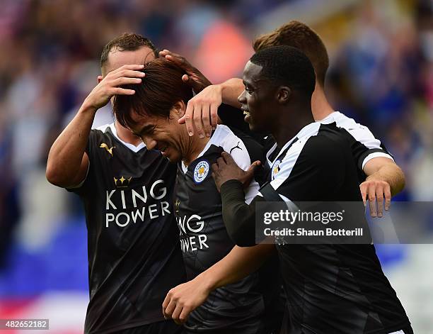 Shinji Okazaki of Leicester City is congratulated by team-mates after scoring during the Pre-Season Friendly match between Birmingham City and...