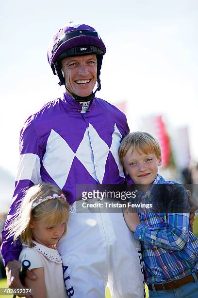 Retiring jockey Richard Hughes with daughter Phoebe and son Harvey on day five of the Qatar Goodwood Festival at Goodwood Racecourse on August 1,...
