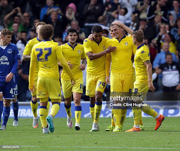 Chris Wood of Leeds United celebrates with his team-mates after he scores the second goal for his side during the Pre Season Friendly match between...