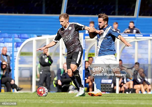 Marc Albrighton of Leicester City in action with Andrew Shinnie of Birmingham City during the pre-season friendly between Birmingham City and...