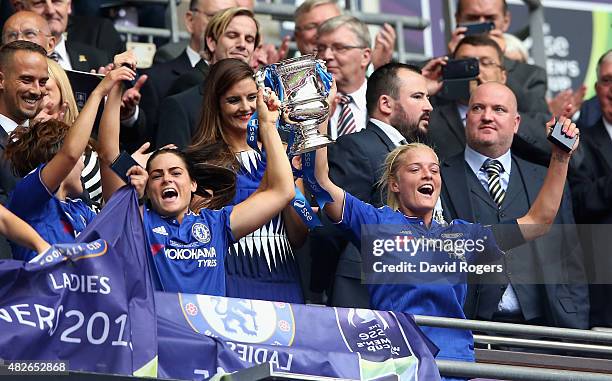 Katie Chapman, the Chelsea captain, raises the trophy after their victory during the Women's FA Cup Final match between Chelsea Ladies FC and Notts...