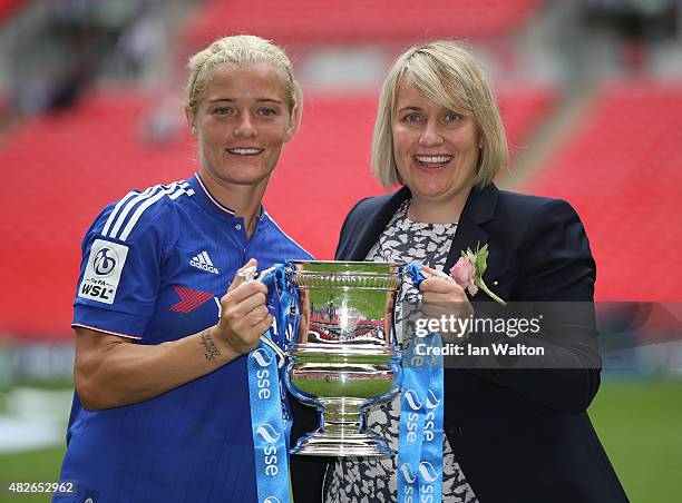 Chelsea Ladies FC manager Emma Hayes and Katie Chapman celebrates with the trophy after winning the Women's FA Cup Final match between Chelsea Ladies...