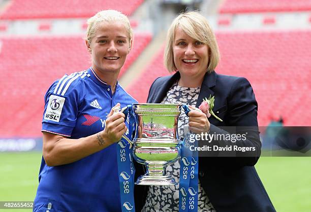 Katie Chapman, the Chelsea captain, holds the trophy with team manager Emma Hayes after their victory during the Women's FA Cup Final match between...