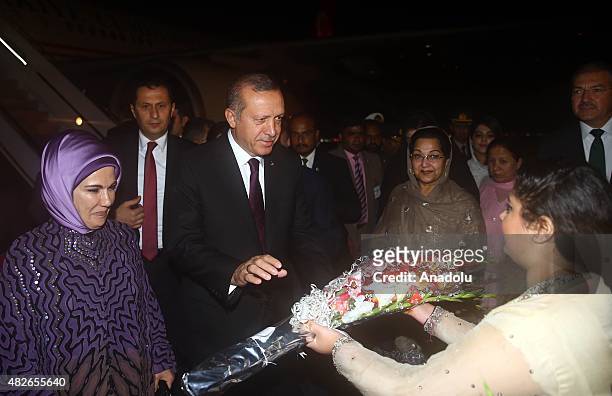 Turkey's President Recep Tayyip Erdogan and Emine Erdogan arrive in Islamabad to meet Pakistani Prime Minister Nawaz Sharif on August 1, 2015....