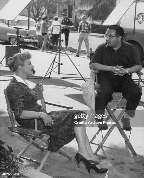 Actress Eve Arden and director Al Lewis on the set of the television show 'Our Miss Brooks', circa 1952-1956.