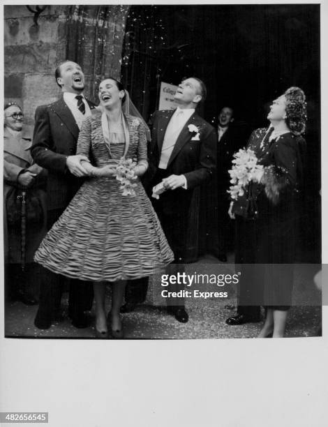 Actors Sir Laurence Olivier and Vivien Leigh, at the wedding of actor Frank Thring and model Joan Cunliffe, Stratford-upon-Avon, England, November...