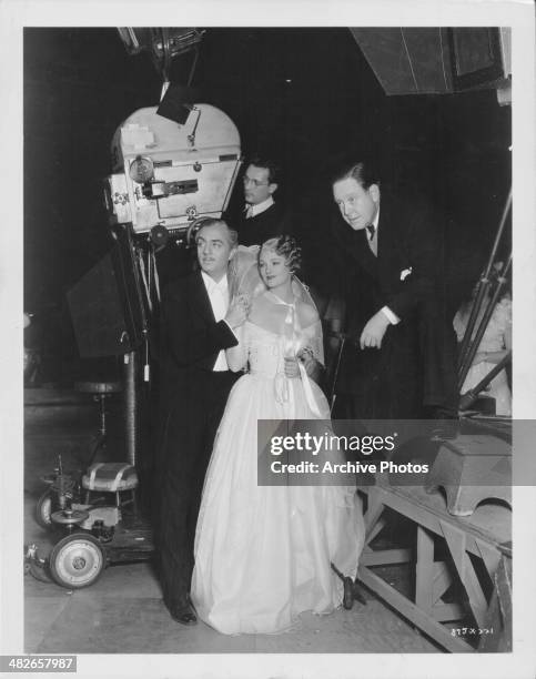 Actors William Powell and Myrna Loy talking to director Robert Z Leonard on the set of the movie 'The Great Ziegfeld', 1936.