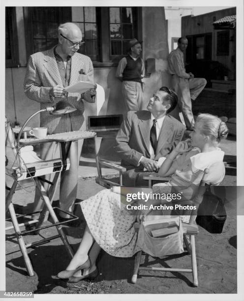 Director Mitchell Leisen and actors Glenn Ford and Nina Foch on the set of the movie 'Young Man with Ideas', 1952.