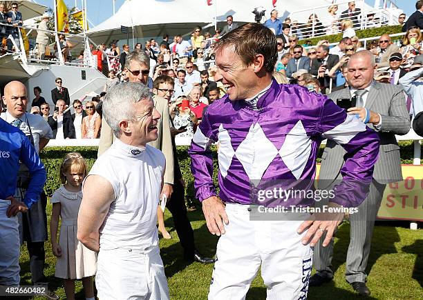 Retiring jockey Richard Hughes and jockey Franny Norton on day five of the Qatar Goodwood Festival at Goodwood Racecourse on August 1, 2015 in...