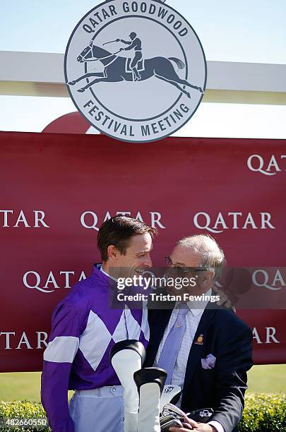 Retiring jockey Richard Hughes with Seamus Buckley, Goodwood's Clerk of the Course, on day five of the Qatar Goodwood Festival at Goodwood Racecourse...