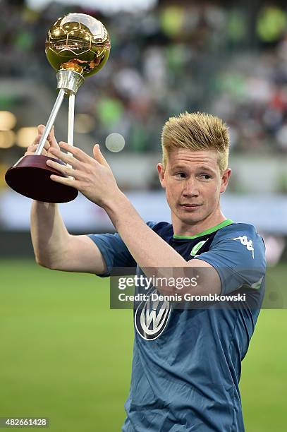 Kevin De Bruyne of VfL Wolfsburg is honored as player of the year by german sport magazine KICKER prior to kickoff during the DFL Supercup 2015 match...