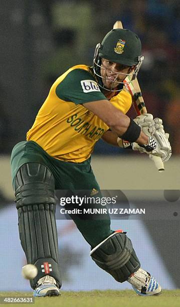 South African cricketer Jean-Paul Duminy plays a shot during the ICC World Twenty20 cricket tournament second semi-final match between India and...