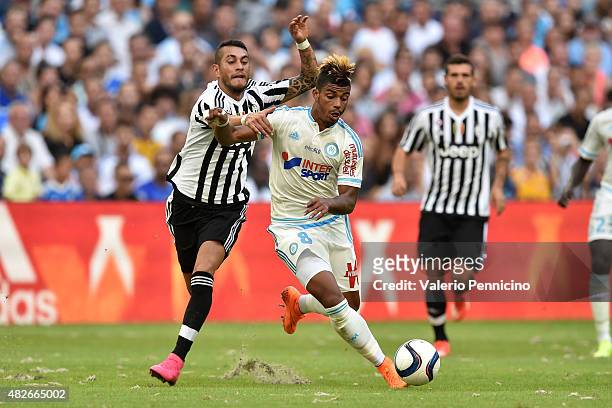 Mario Lemina of Olympique de Marseille is challenged by Roberto Maximiliano Pereyra of Juventus FC during the preseason friendly match between...